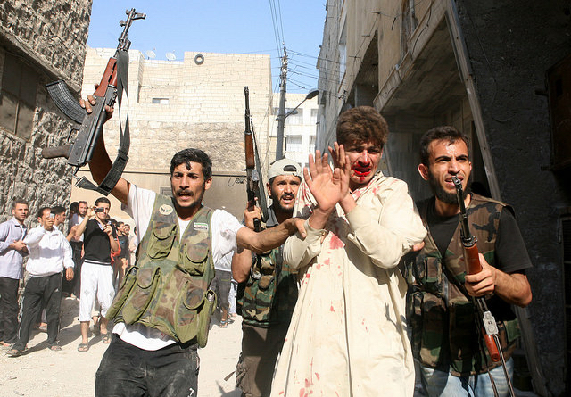 Free Syrian Army rebels with captive. Aleppo, 2012.